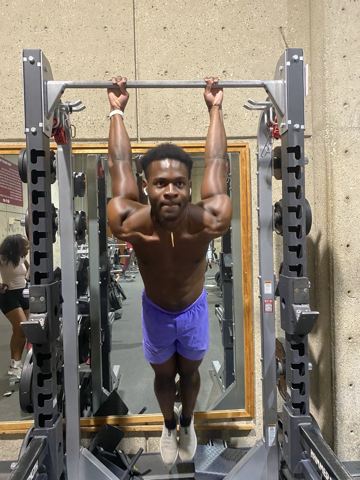 Daniel mid pull-up in the gym