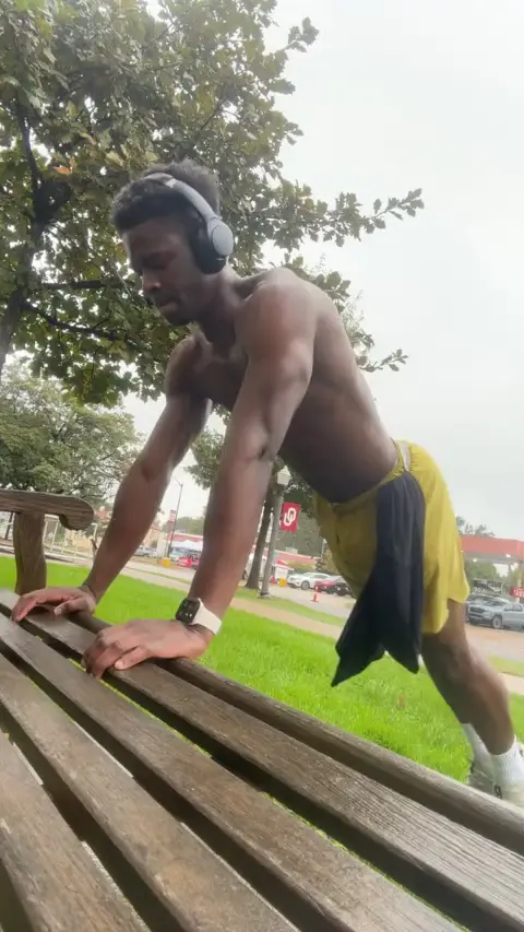 Daniel doing push-ups outside